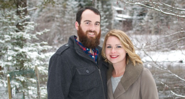 Lauren Whalen, Clinical Supervisor, and her husband headshot standing in front of the snowy woods.